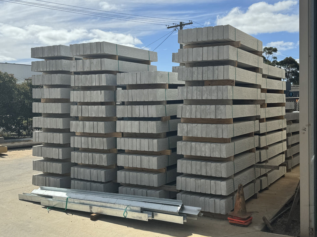 Plain concrete sleepers stacked in the supply yard