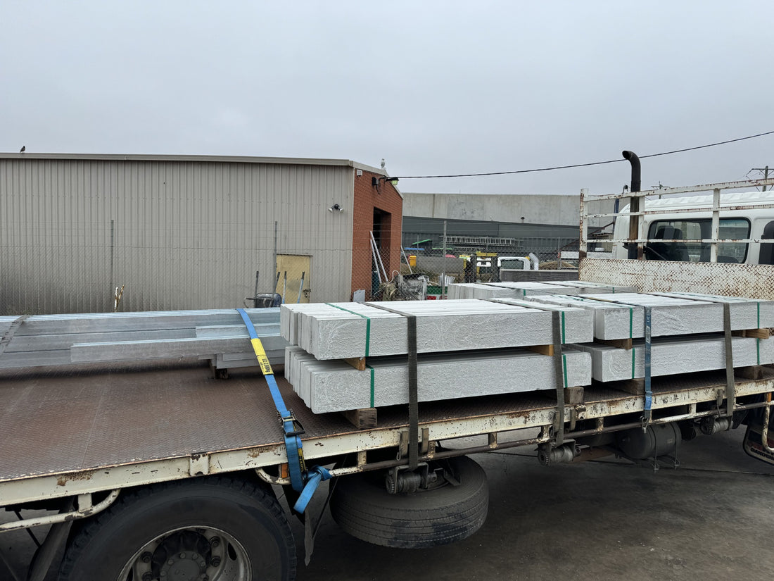 Concrete sleepers and galvanised retaining wall steel loaded together on a truck